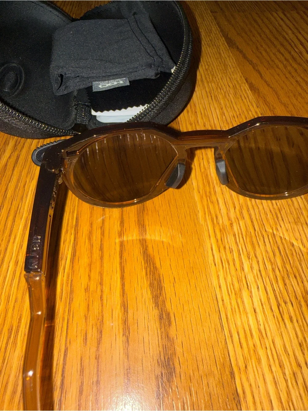 Oakley Translucent Honey Brown Round Frame Sunglasses